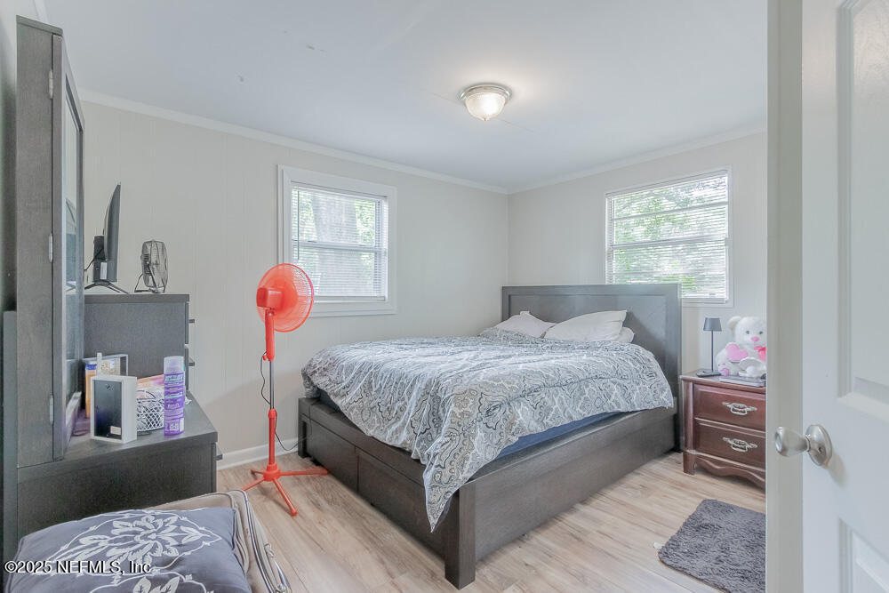 9042 7th Avenue Jacksonville, FL 32208 - Photo 16 of 22 a bed room with a bed and a window