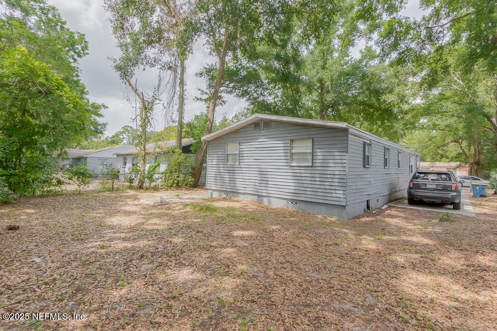 9042 7th Avenue Jacksonville, FL 32208 - Photo 2 of 22 a view of a house with a backyard