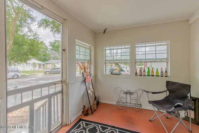 a room with furniture and a window