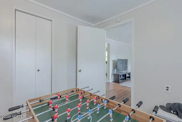 a bedroom with a bed and cabinets