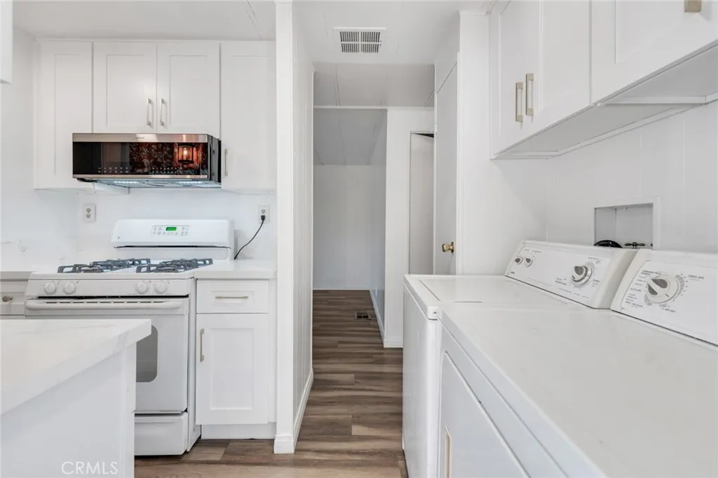 4000 Pierce Street, Unit 295 Riverside, CA 92501 - Photo 11 of 29 a kitchen with white cabinets and sink