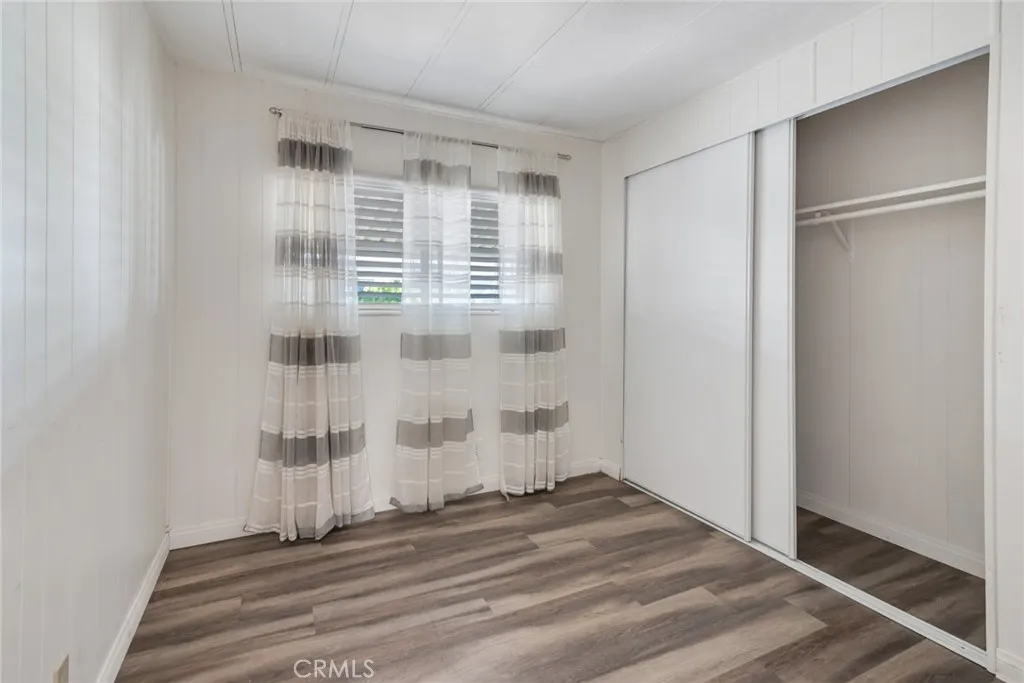 4000 Pierce Street, Unit 295 Riverside, CA 92501 - Photo 12 of 29 a view of wooden floor and windows in a room