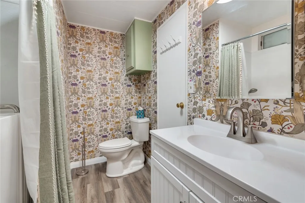 4000 Pierce Street, Unit 295 Riverside, CA 92501 - Photo 13 of 29 a bathroom with a sink toilet and shower