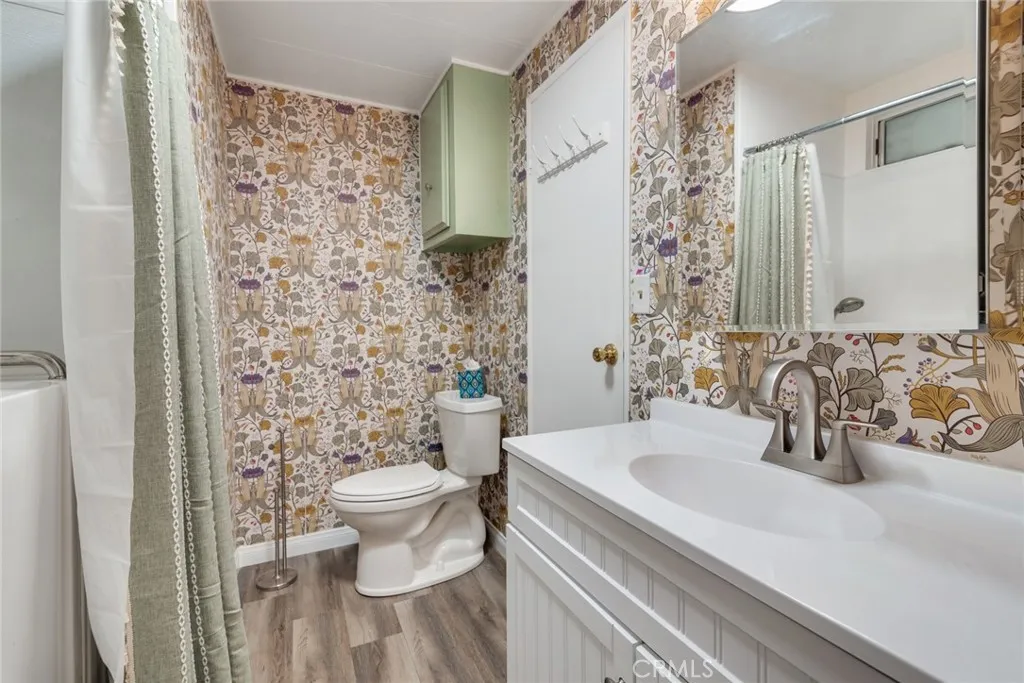 4000 Pierce Street, Unit 295 Riverside, CA 92501 - Photo 13 of 29 a bathroom with a sink toilet and shower