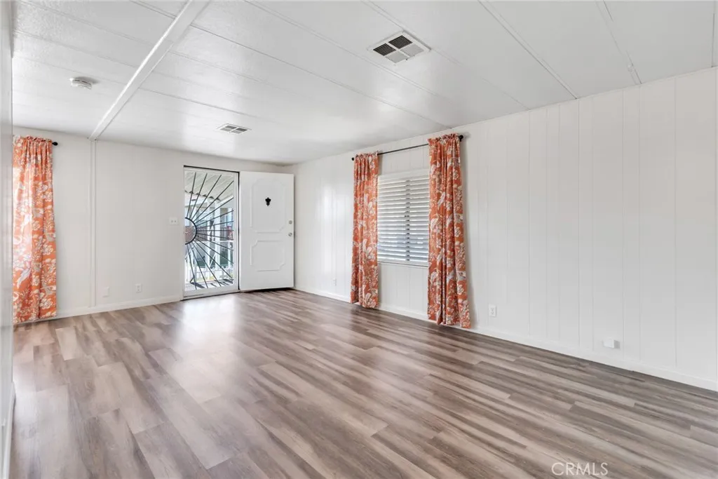 4000 Pierce Street, Unit 295 Riverside, CA 92501 - Photo 18 of 29 wooden floor in an empty room with a window