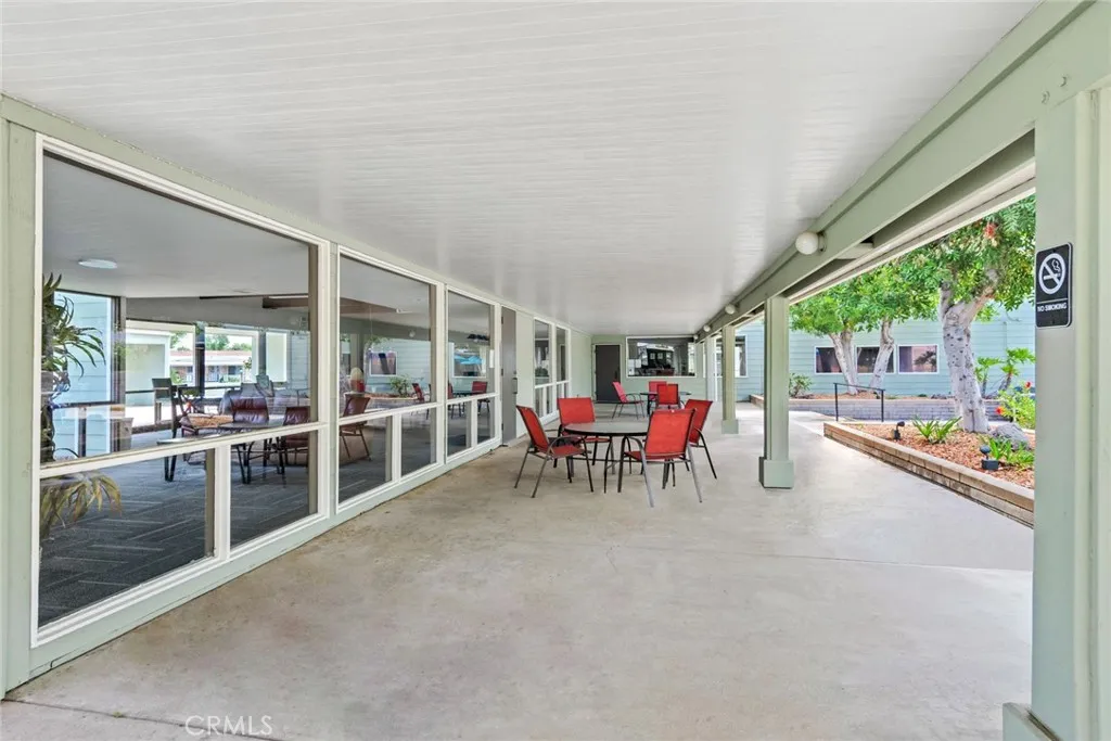 4000 Pierce Street, Unit 295 Riverside, CA 92501 - Photo 24 of 29 a view of a dining room with furniture and garden view