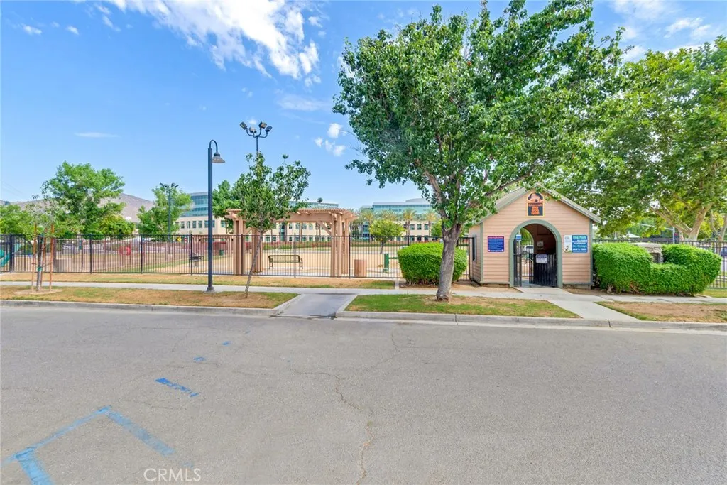 4000 Pierce Street, Unit 295 Riverside, CA 92501 - Photo 29 of 29 a view of swimming pool with a yard and palm trees
