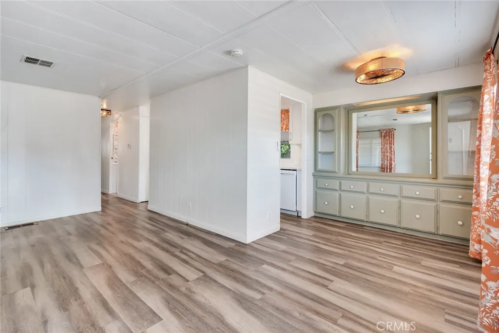 4000 Pierce Street, Unit 295 Riverside, CA 92501 - Photo 4 of 29 a view of a room with wooden floor and window