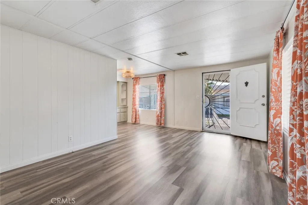 4000 Pierce Street, Unit 295 Riverside, CA 92501 - Photo 6 of 29 wooden floor in an empty room with a window