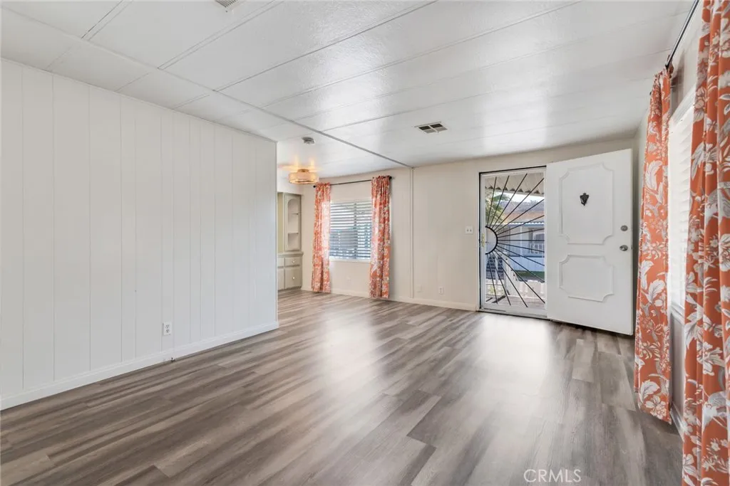 4000 Pierce Street, Unit 295 Riverside, CA 92501 - Photo 6 of 29 wooden floor in an empty room with a window