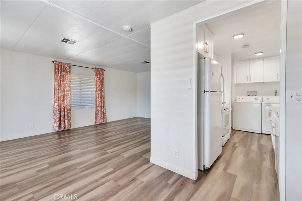 4000 Pierce Street, Unit 295 Riverside, CA 92501 - Photo 7 of 29 a view of a bathroom with wooden floor