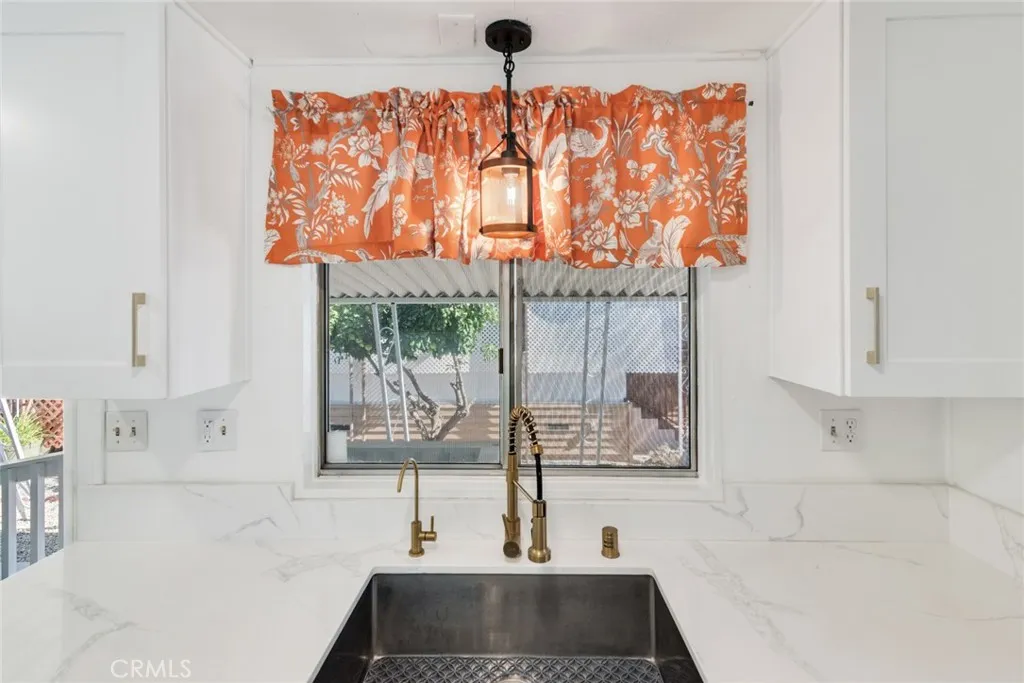 4000 Pierce Street, Unit 295 Riverside, CA 92501 - Photo 10 of 29 a bathroom with a bathtub sink and window