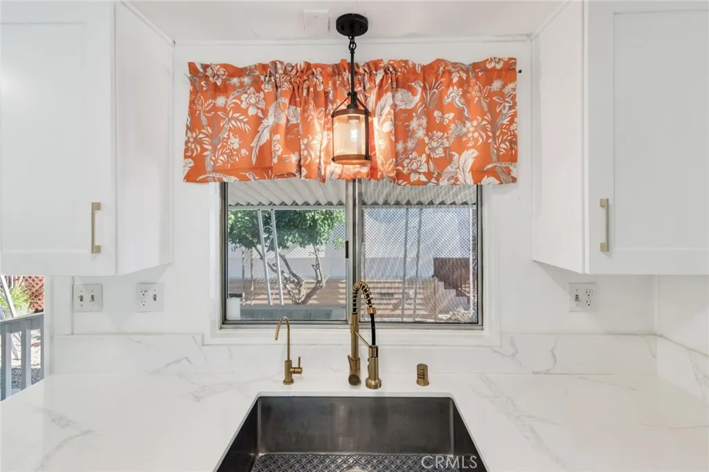 4000 Pierce Street, Unit 295 Riverside, CA 92501 - Photo 10 of 29 a bathroom with a bathtub sink and window
