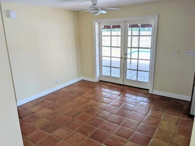 a view of an empty room and a window