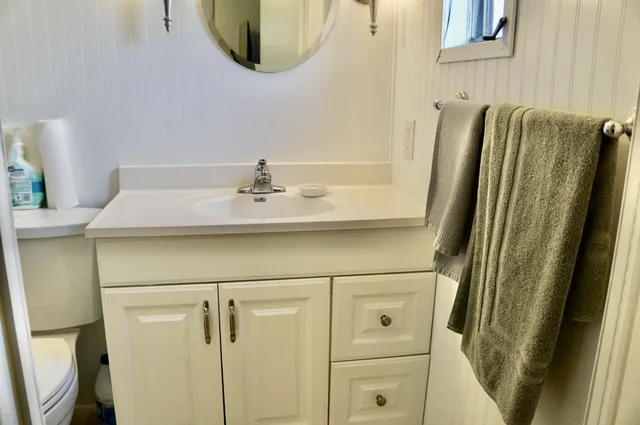 a bathroom with a shower and a mirror