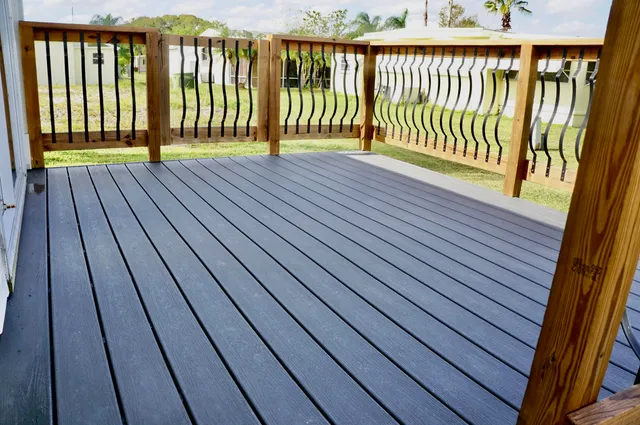 a view of deck with wooden floor and fence