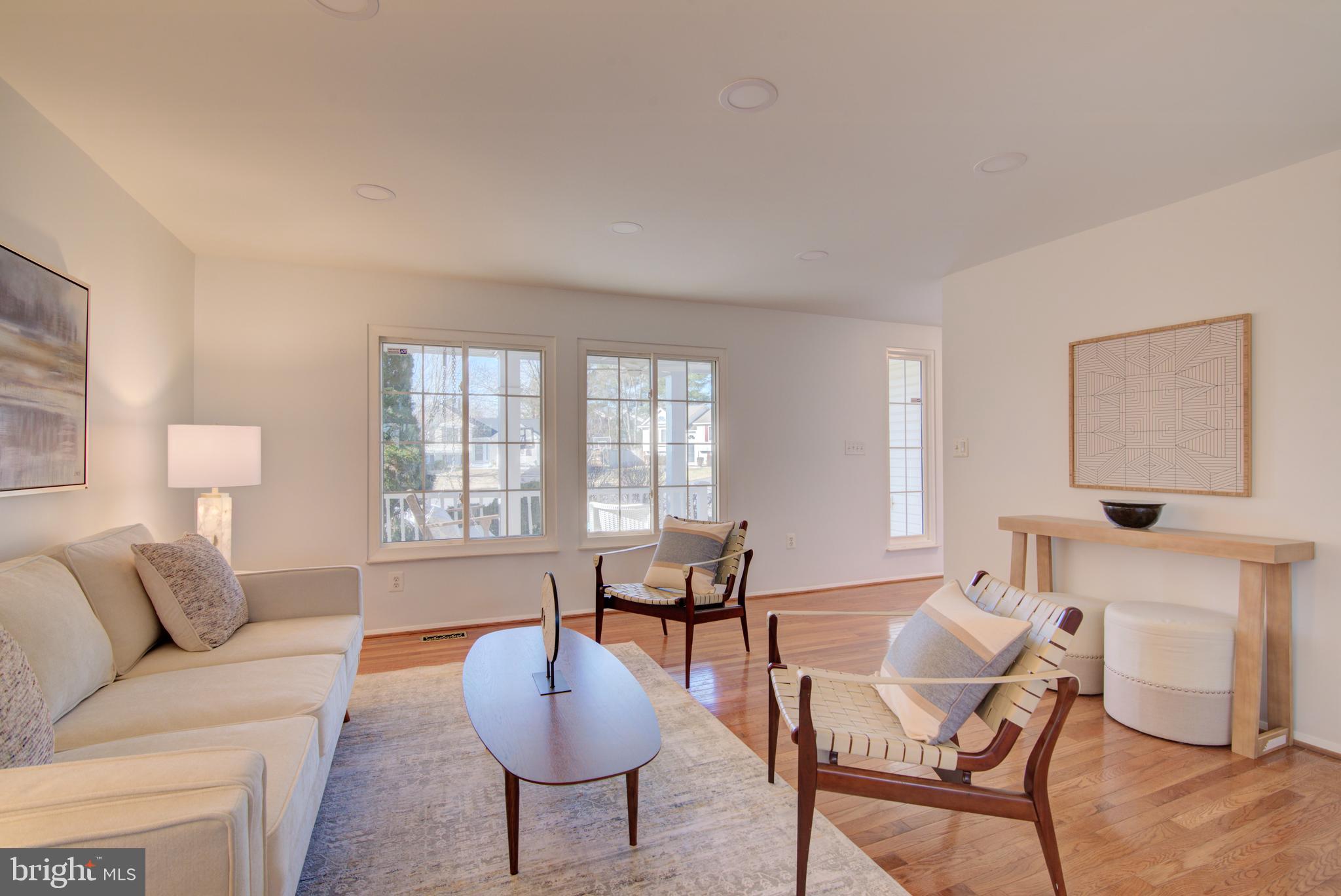 304 Aaron Court Sterling, VA 20164 - Photo 5 of 28 Living Room with Windows Overlooking Front Porch.