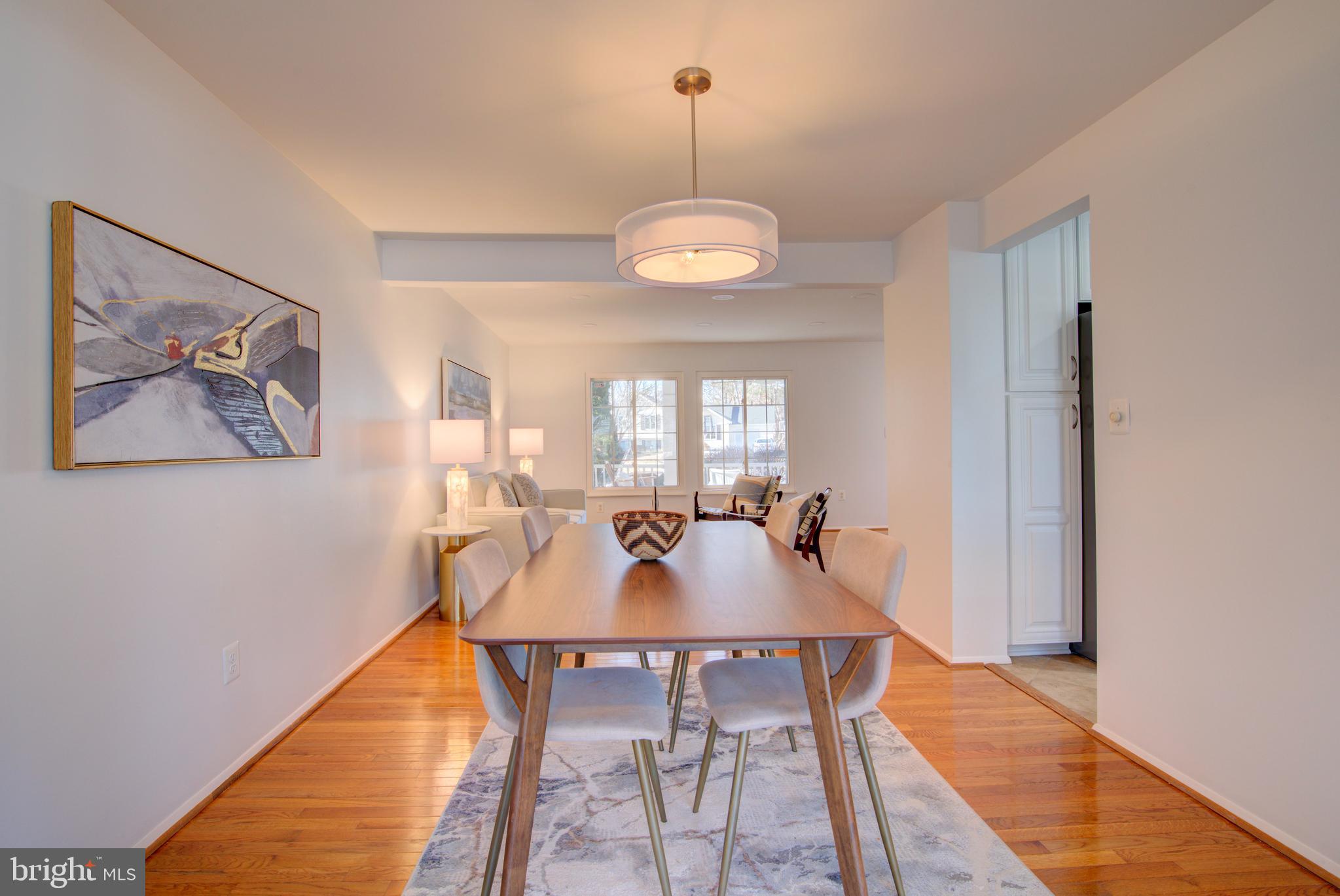 304 Aaron Court Sterling, VA 20164 - Photo 6 of 28 Dining Room with Gleaming Hardwood Floors.