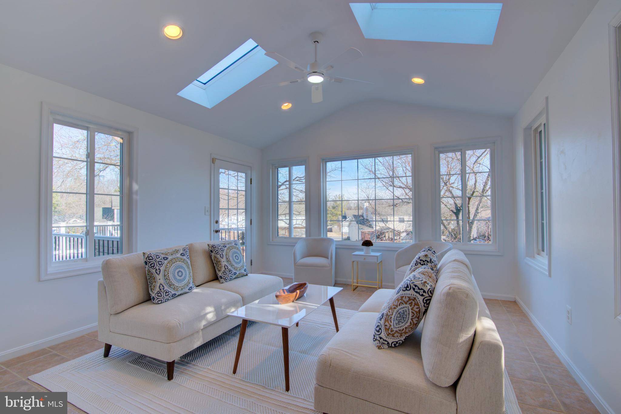 304 Aaron Court Sterling, VA 20164 - Photo 7 of 28 Sunroom:Vaulted Ceiling/Skylights/Access to Deck.