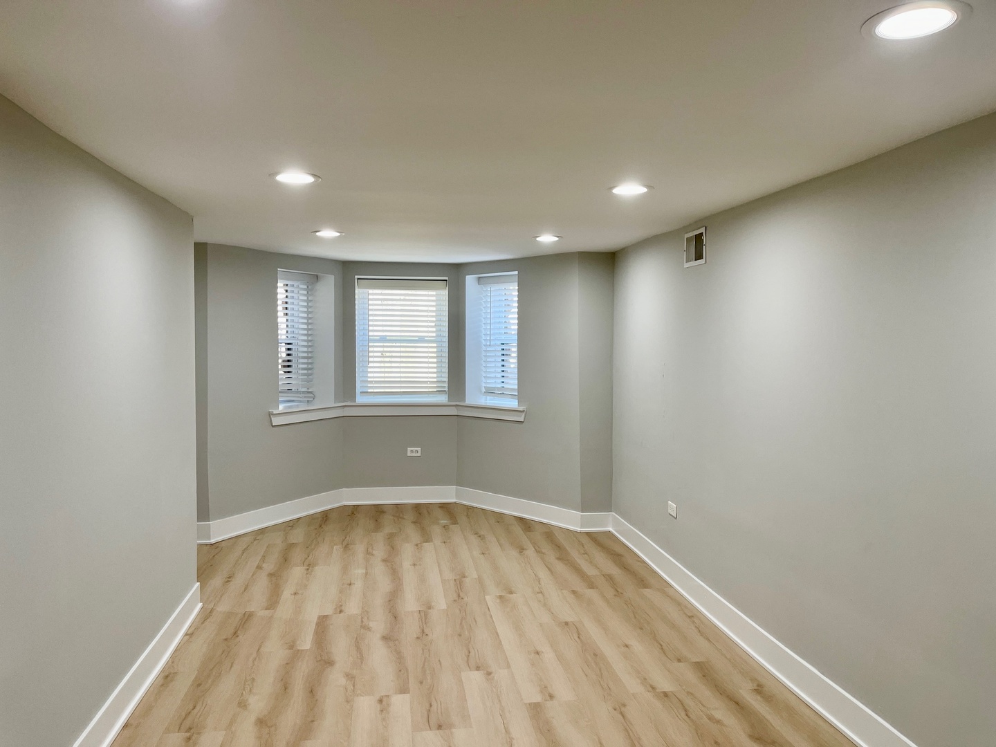 2239 West 19th Street, Unit G Chicago, IL 60608 - Photo 13 of 17 a view of empty room with wooden floor and fan