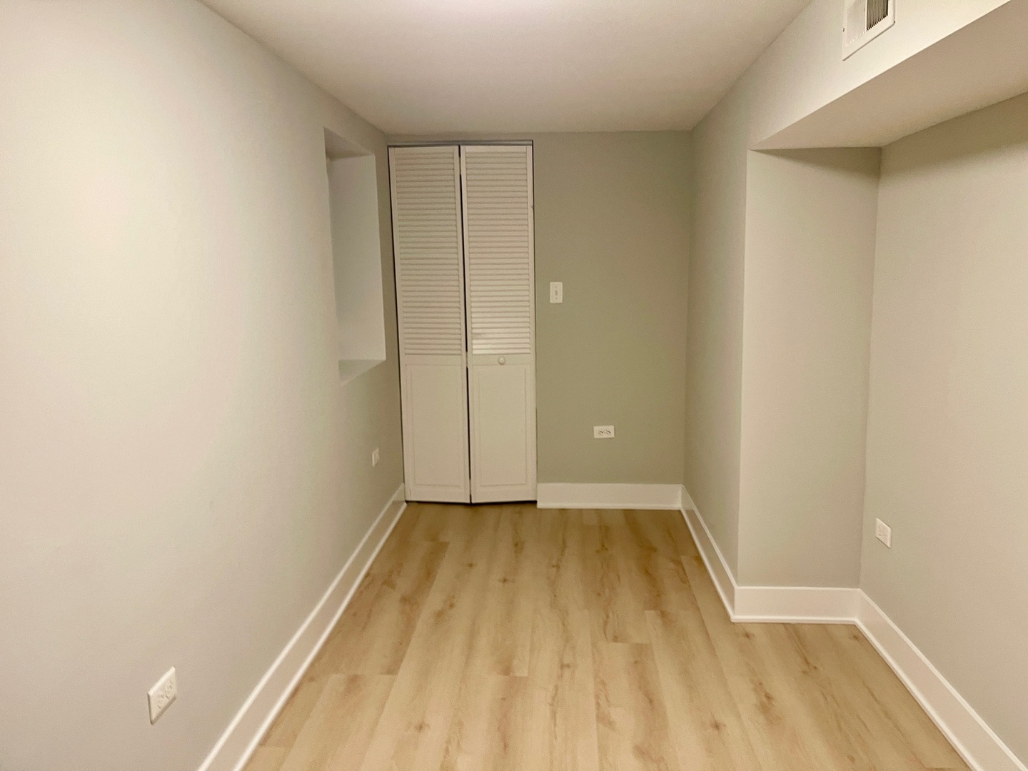 2239 West 19th Street, Unit G Chicago, IL 60608 - Photo 14 of 17 a view of a room with wooden floor and a window