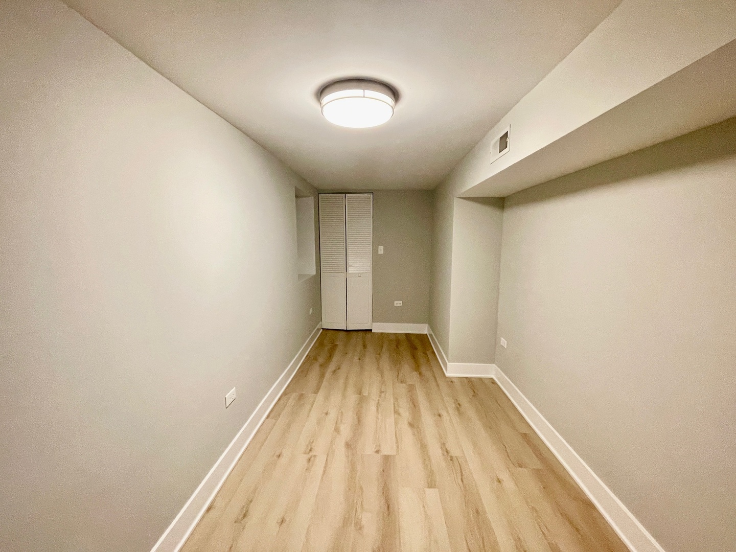 2239 West 19th Street, Unit G Chicago, IL 60608 - Photo 15 of 17 a view of room with wooden floor