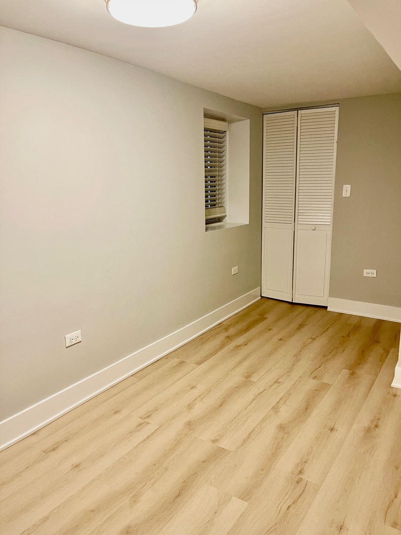 2239 West 19th Street, Unit G Chicago, IL 60608 - Photo 17 of 17 an empty room with a natural light