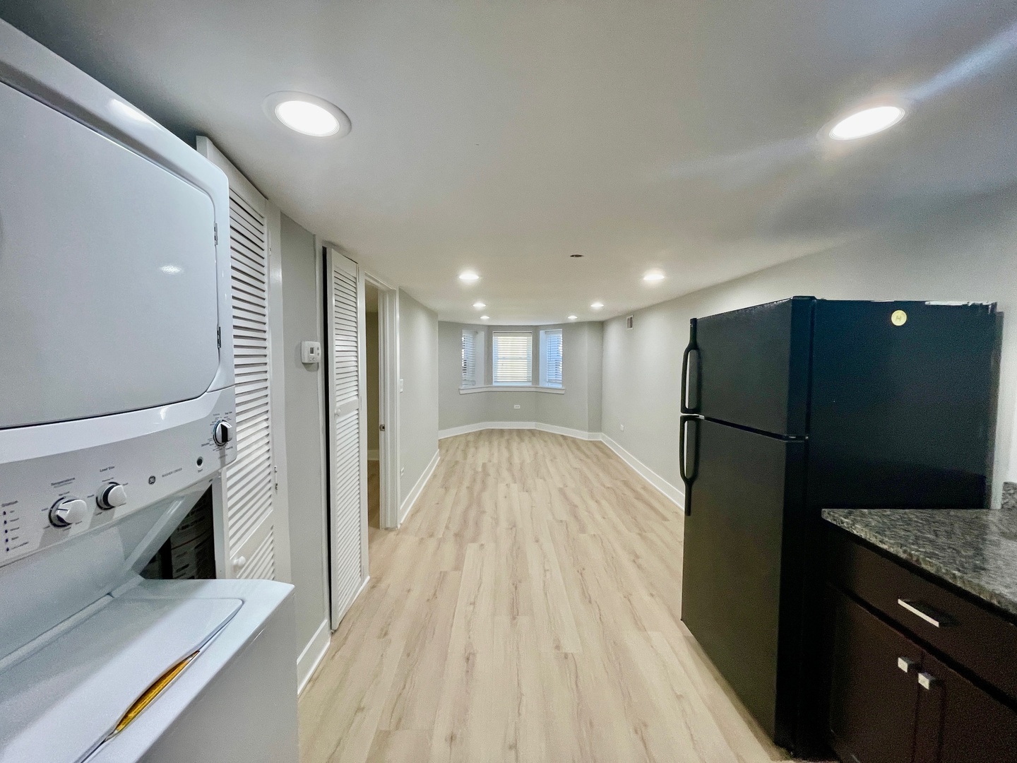 2239 West 19th Street, Unit G Chicago, IL 60608 - Photo 5 of 17 a view of a refrigerator in kitchen and wooden floor