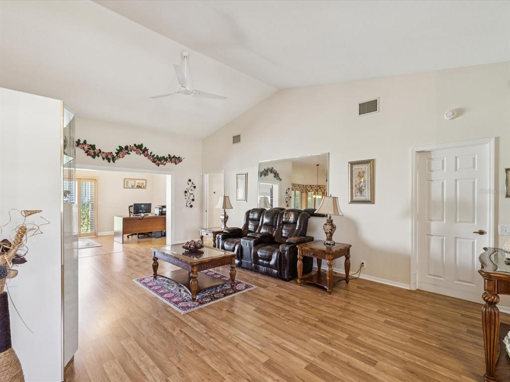 8401 Pavilion Drive Hudson, FL 34667 - Photo 11 of 81 a living room with furniture and a wooden floor