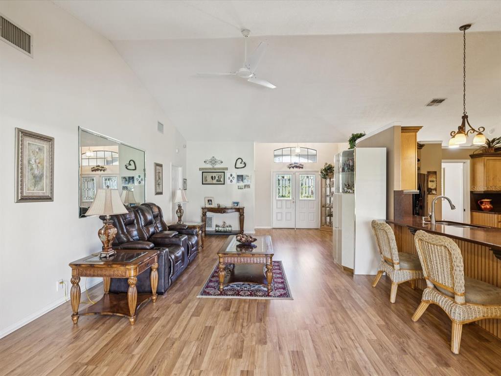 8401 Pavilion Drive Hudson, FL 34667 - Photo 12 of 81 a living room with furniture and a wooden floor
