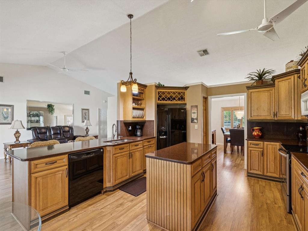 8401 Pavilion Drive Hudson, FL 34667 - Photo 15 of 81 a kitchen with stainless steel appliances granite countertop a sink stove and refrigerator