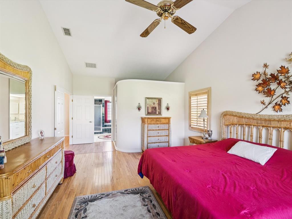 8401 Pavilion Drive Hudson, FL 34667 - Photo 22 of 81 a bed room with a bed and a chandelier