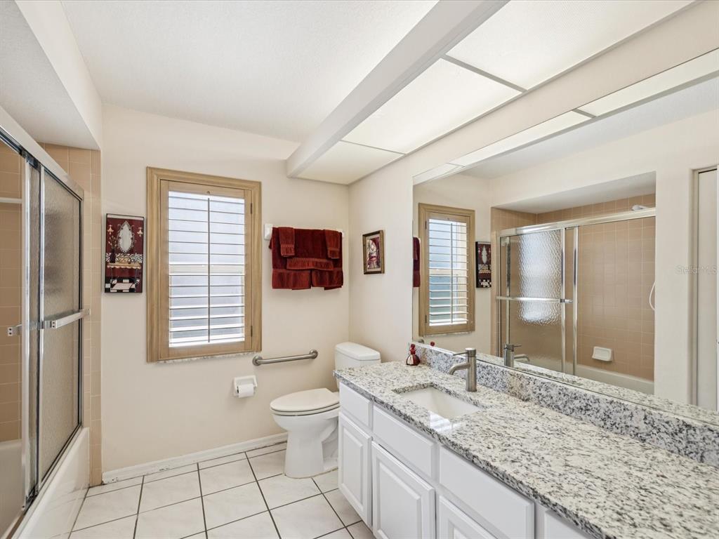 8401 Pavilion Drive Hudson, FL 34667 - Photo 29 of 81 a spacious bathroom with a granite countertop sink toilet and shower