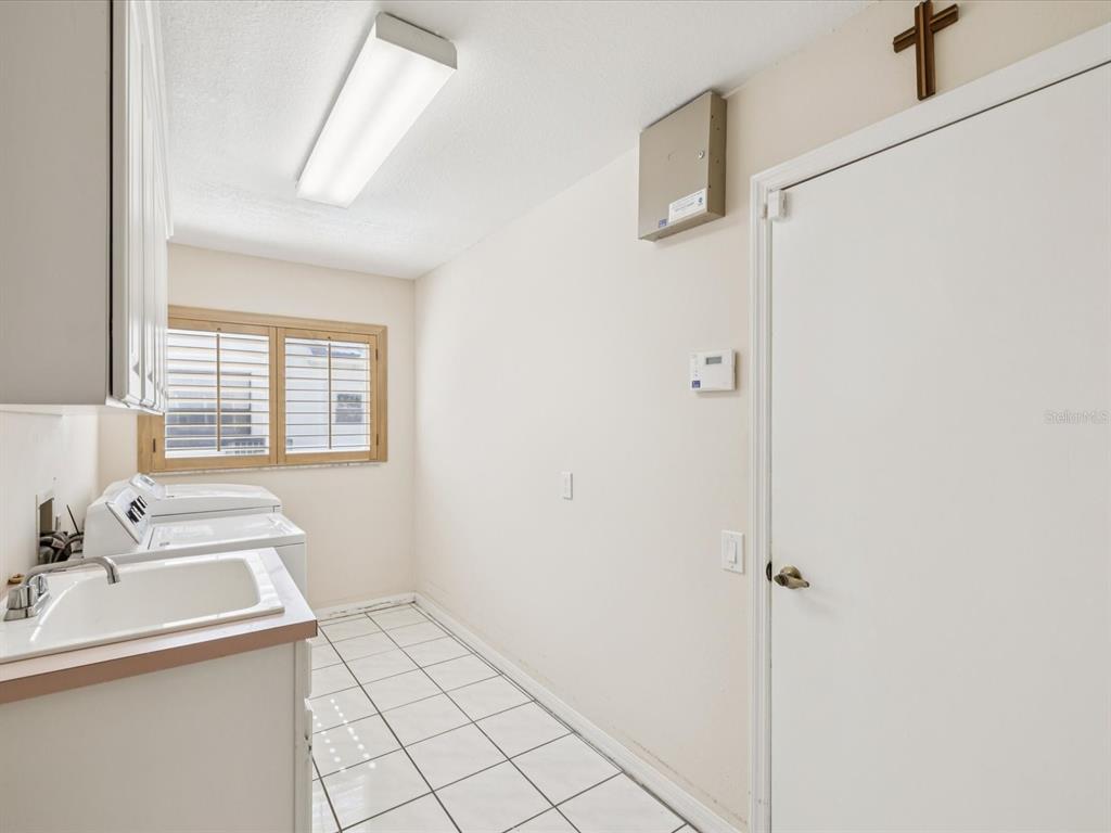 8401 Pavilion Drive Hudson, FL 34667 - Photo 34 of 81 a bathroom with a sink and a mirror