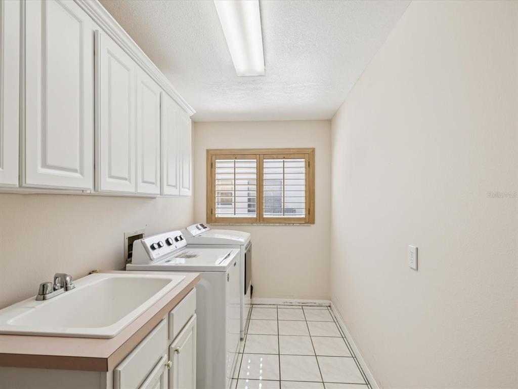 8401 Pavilion Drive Hudson, FL 34667 - Photo 35 of 81 a utility room with dryer and washer