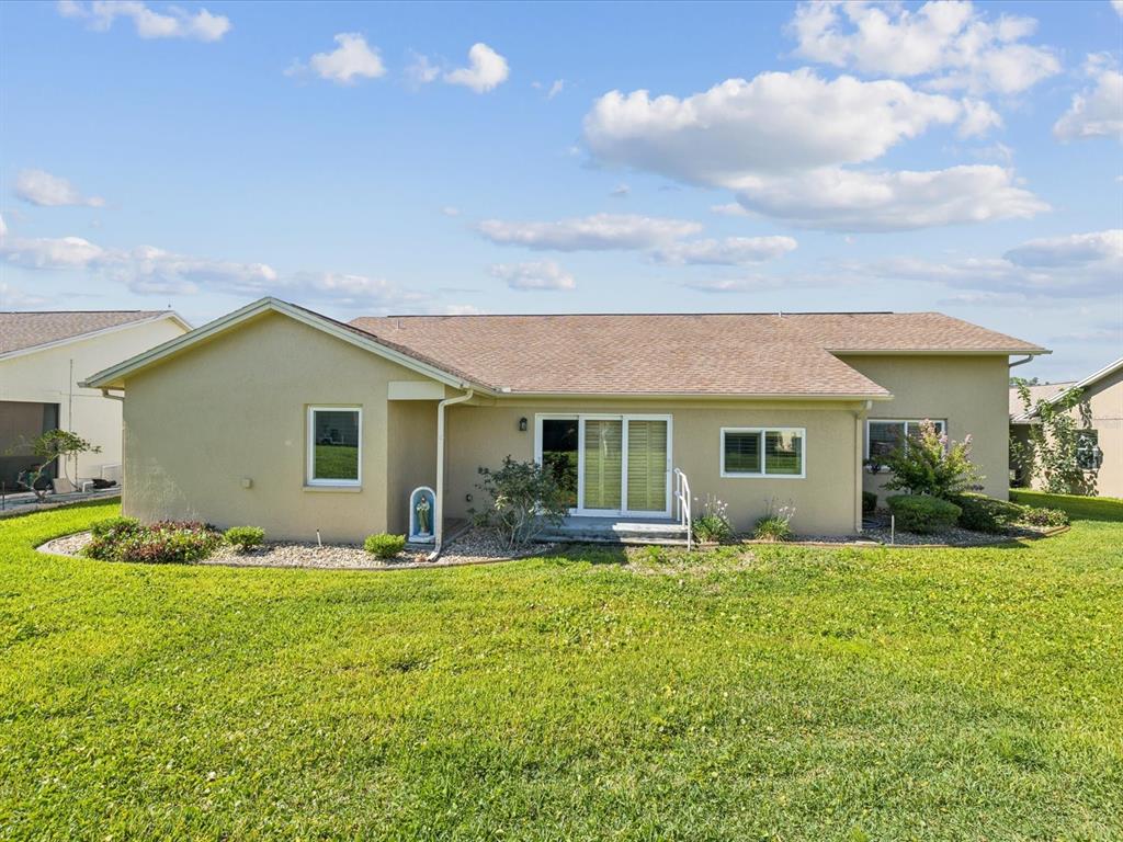 8401 Pavilion Drive Hudson, FL 34667 - Photo 37 of 81 a front view of house with yard and trees