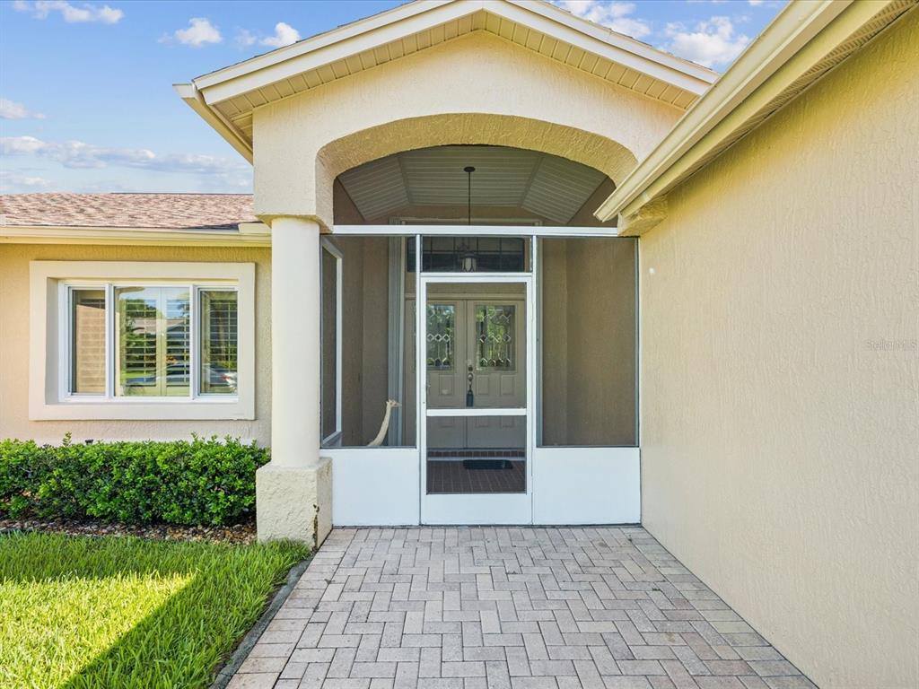 8401 Pavilion Drive Hudson, FL 34667 - Photo 4 of 81 a front view of a house with a yard