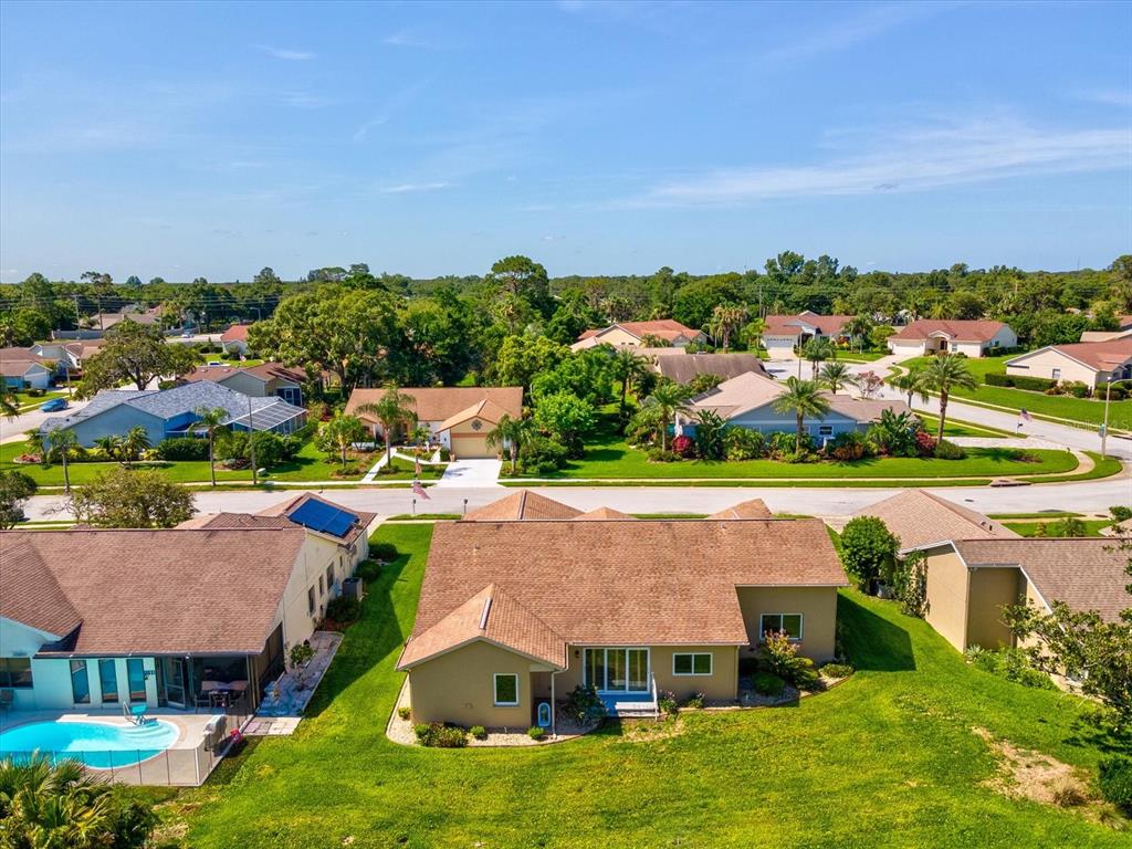 8401 Pavilion Drive Hudson, FL 34667 - Photo 49 of 81 an aerial view of residential houses with outdoor space and trees
