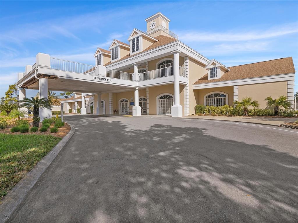 8401 Pavilion Drive Hudson, FL 34667 - Photo 54 of 81 a front view of a house with a garden