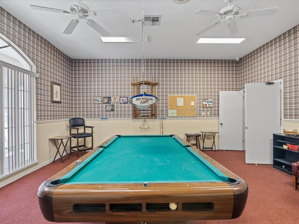 8401 Pavilion Drive Hudson, FL 34667 - Photo 60 of 81 a room with pool table and windows