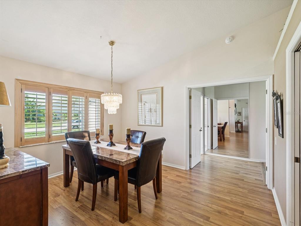 8401 Pavilion Drive Hudson, FL 34667 - Photo 7 of 81 a view of a dining room with furniture window and wooden floor