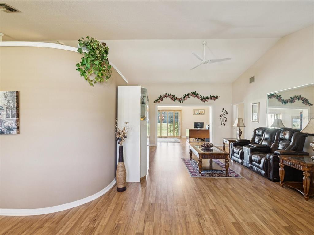 8401 Pavilion Drive Hudson, FL 34667 - Photo 9 of 81 a living room with furniture and wooden floor