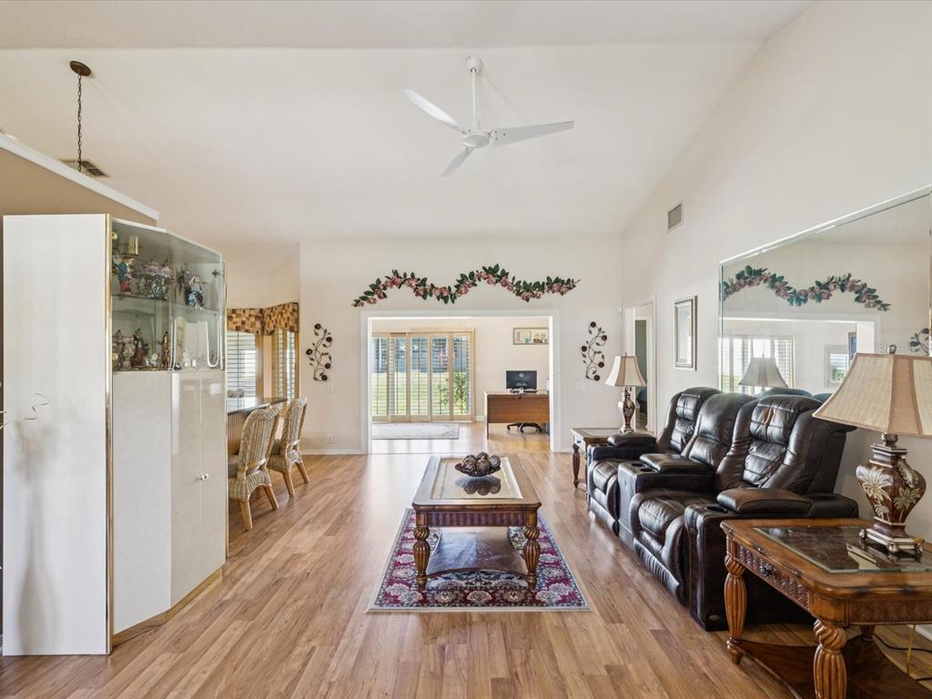 8401 Pavilion Drive Hudson, FL 34667 - Photo 10 of 81 a living room with furniture and a wooden floor