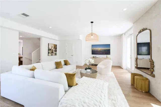a kitchen with kitchen island stainless steel appliances sink stove and cabinets