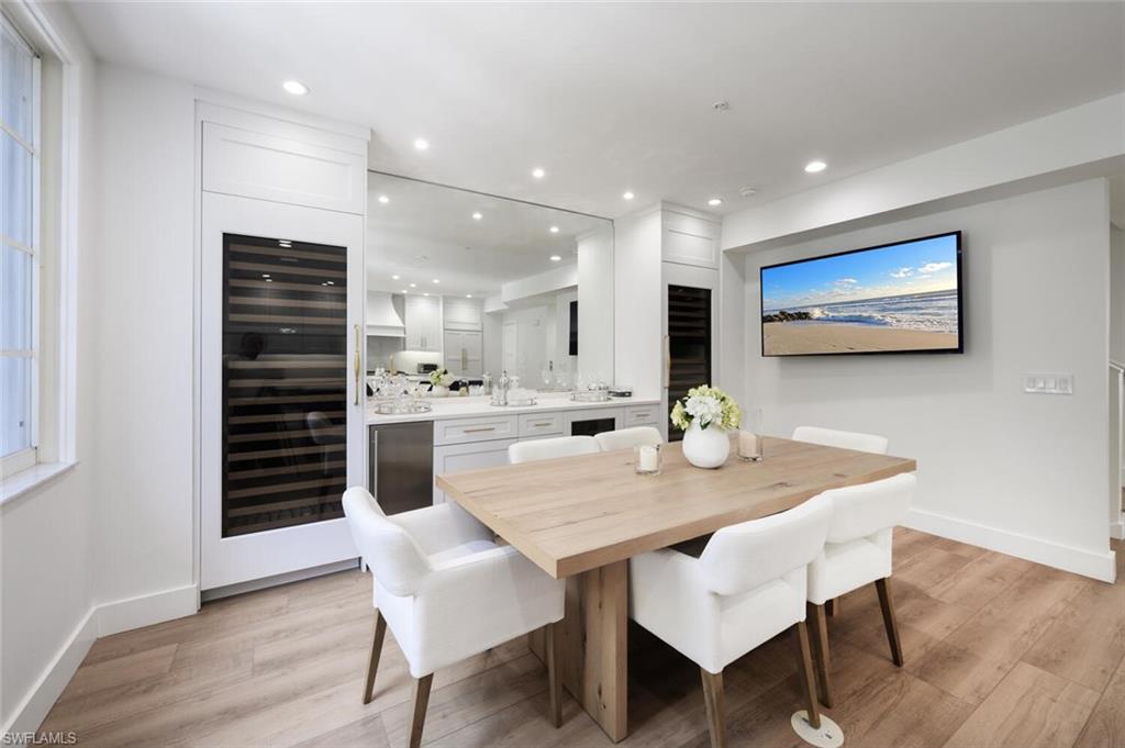 888 10th Street South, Unit 101 Naples, FL 34102 - Photo 19 of 44 a view of a dining room with furniture