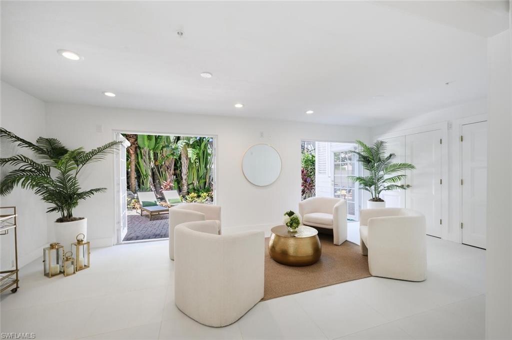 888 10th Street South, Unit 101 Naples, FL 34102 - Photo 22 of 44 a living room with furniture and a potted plant