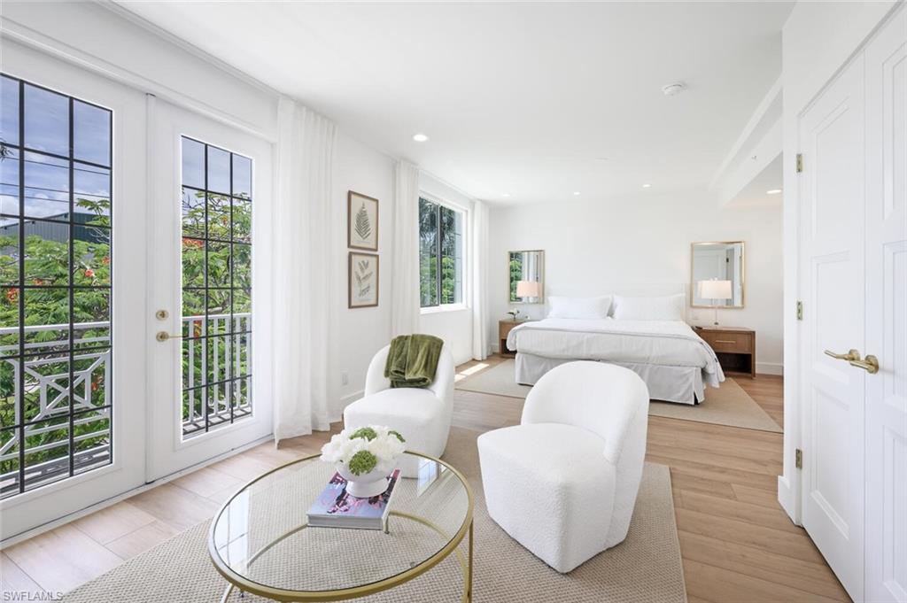 888 10th Street South, Unit 101 Naples, FL 34102 - Photo 25 of 44 a living room with furniture and a large window
