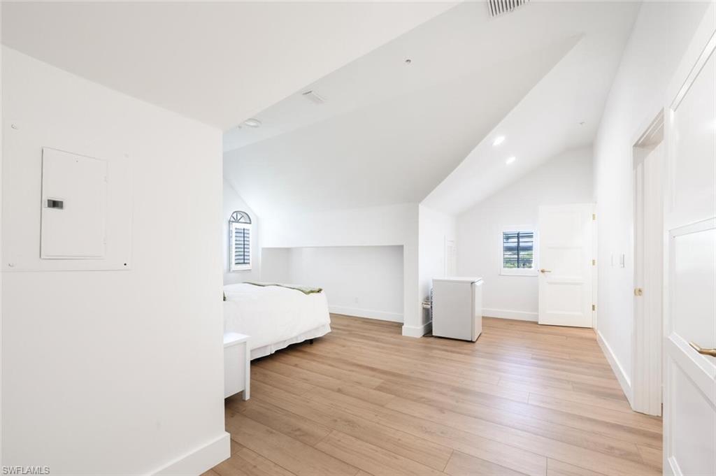 888 10th Street South, Unit 101 Naples, FL 34102 - Photo 34 of 44 a view of a room with wooden floor and window