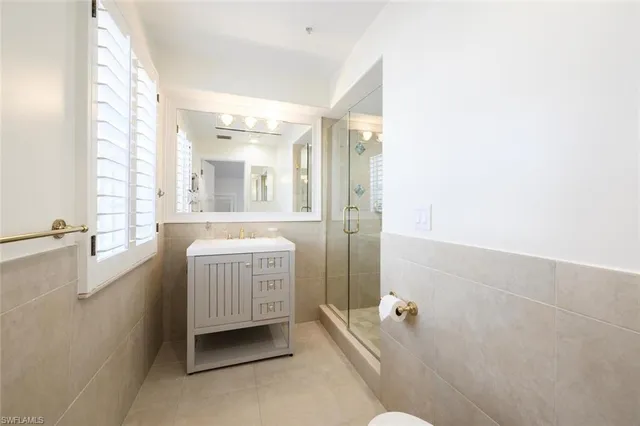a bathroom with a sink a vanity and a bathtub