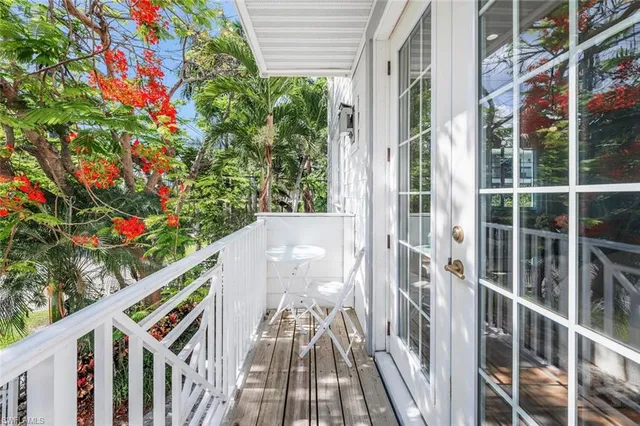 a view of a balcony with wooden floor